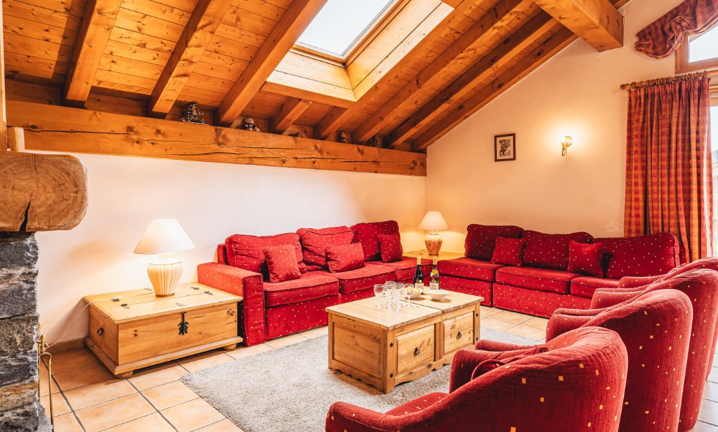 The Living area with a fireplace in Chalet Azalee Meribel