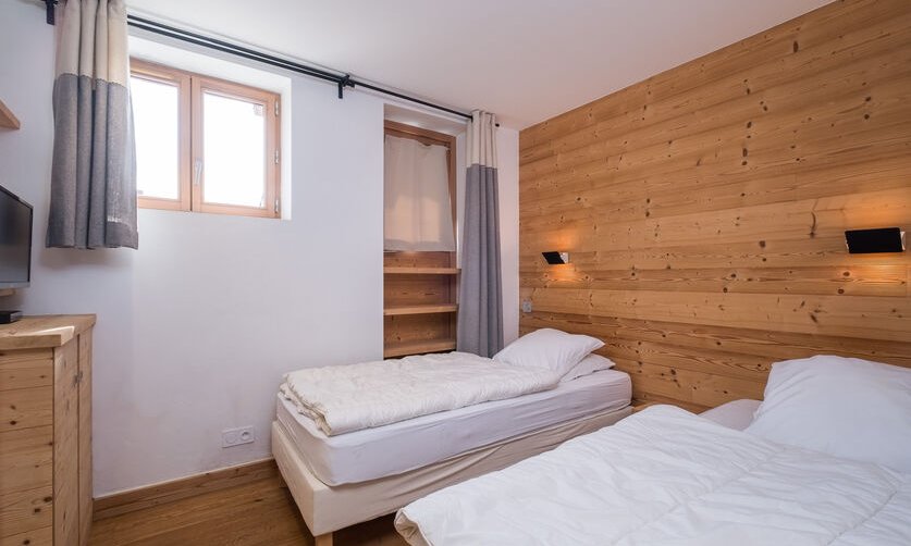 A bedroom in Chalet Arbe Meribel Village