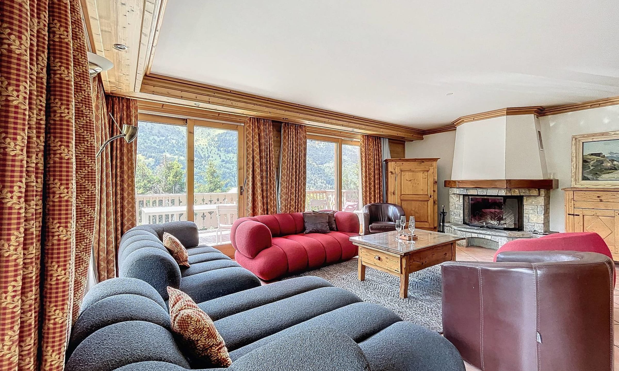 The Living area with fireplace in Chalet Serpolet Meribel Centre