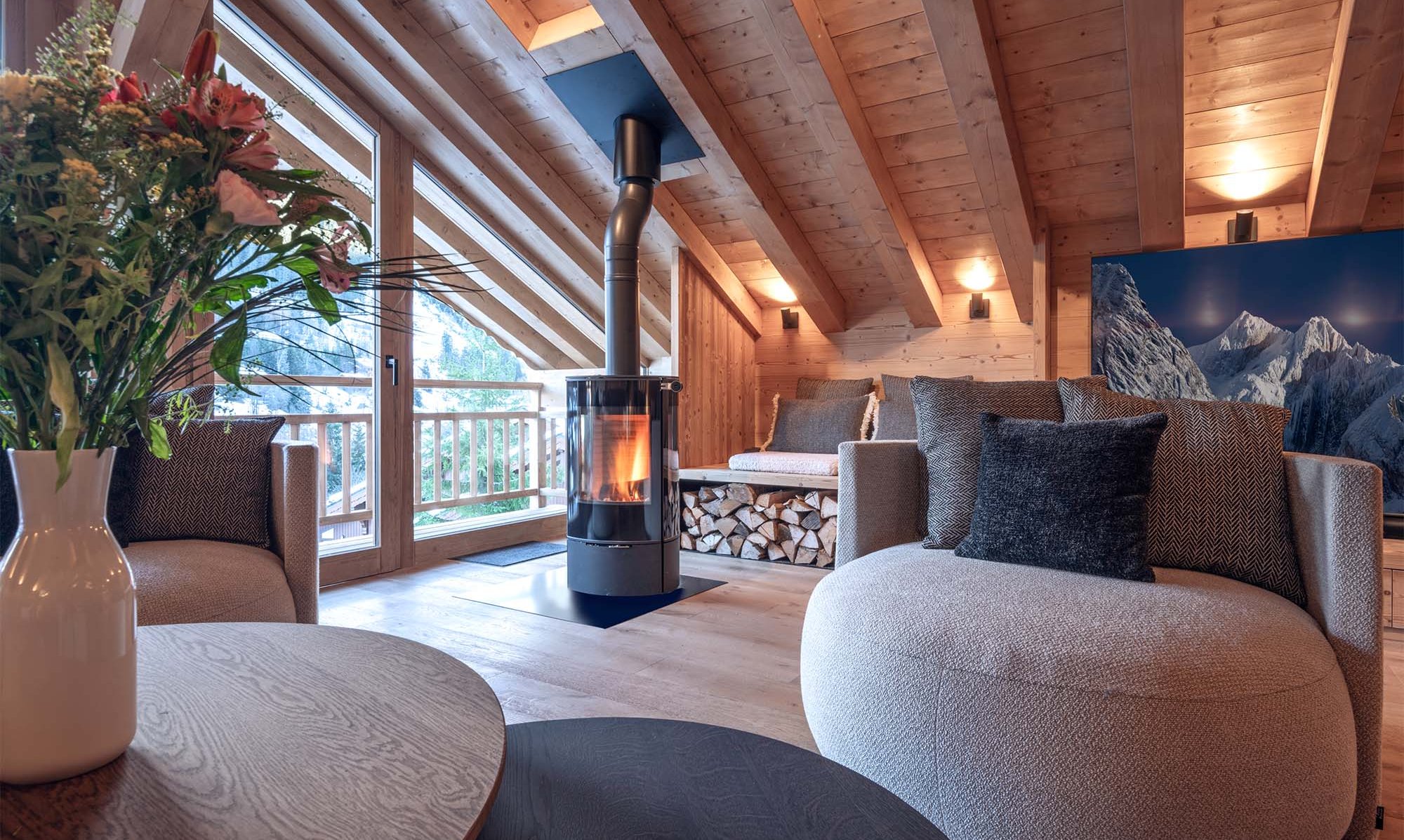 The Living area with Stove in Chalet Harmony Meribel