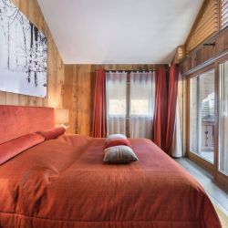 One of the Double bedrooms in Apartment Aspen Park 61 Meribel