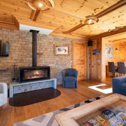 The comfortable Living area with Fireplace in Chalet L'Ancolie Meribel