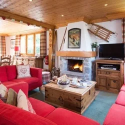 The Living room with fireplace in Chalet Bruyere Meribel Le Raffort