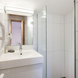 A shower room in Chalet Arbe Meribel Village