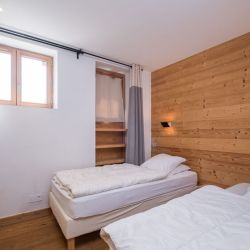 A bedroom in Chalet Arbe Meribel Village