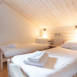 One of the bedrooms in Chalet Le Cedre Blanc Meribel
