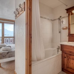 An ensuite bedroom in Catered Chalet Bonhomme Val Thorens