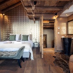 A spacious bedroom in Catered Chalet Cheval Blanc Meribel Le Raffort