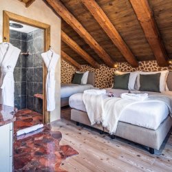 One of the lovely bedrooms in Catered Chalet Cheval Blanc Meribel Le Raffort