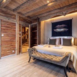 A double bedroom in Chalet Cheval Blanc Meribel Le Raffort