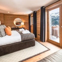 One of the spacious bedrooms in Chalet Le Grenier Meribel Centre