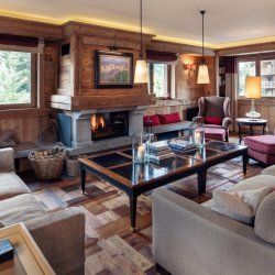 The spacious Living area with fireplace in Chalet Trois Ours Meribel Centre