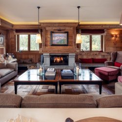 The spacious and comforable Living area with fireplace in Chalet Trois Ours Meribel Centre