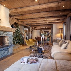 The comfortable Living area with fireplace in Chalet Cheval Blanc Meribel Le Raffort
