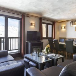 The Living and dining area in one of the 8 person apartments in Chalet des Neiges Hermine apartments in Val Thorens