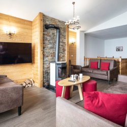 Living area with stove in apartments Les Balcons de Val Thorens