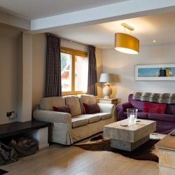 The Livving area and fireplace in Chalet Montana in Meribel Centre