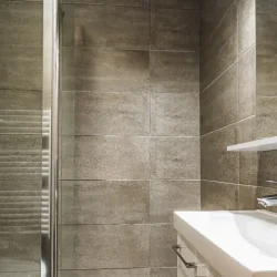 A shower room in Chalet Virage Meribel Centre