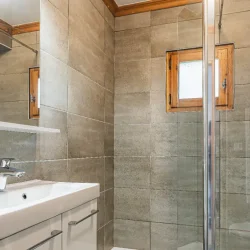 A shower room in Chalet Virage Meribel Centre