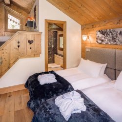 The bedroom with mezzanine area in Chalet Mariefleur in Meribel