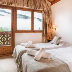 A comfortable bedroom in Chalet Virage Meribel Centre