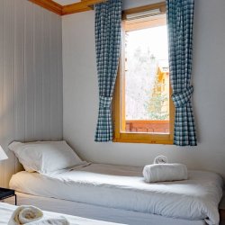 A twin bedroom in Apartment Grand