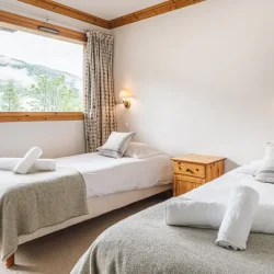 A twin bedroom in Chalet Virage in Meribel Centre
