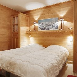 A twin bedroom in Apartment Petaru in Meribel Centre