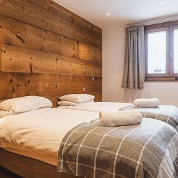 A Twin bedroom in Chalet Germaine Mottaret