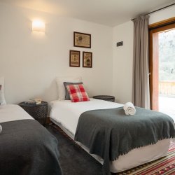 A Twin Bedroom in Chalet Impala Lodge Meribel La Gittaz