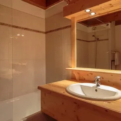 A bathroom in Catered Chalet Pierre Meribel Mottaret