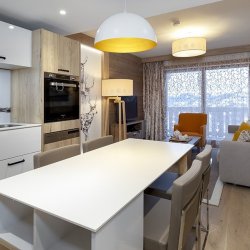 The Kitchen, Dining and Living area in one of well equipped apartments in Residence L'Hevana Meribel