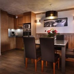The Dining and kitchen area in the 6 person apartment in Chalet des Neiges Hermine apartments in Val Thorens