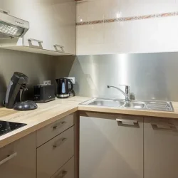 The kitchen area in Catered Chalet Pierre Meribel Mottaret