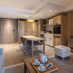 The Living, dining and kitchen areain a 4 person aparment in Residence L'Hevana Meribel