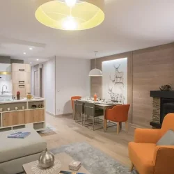 The Living, dining and kitchen areain a 2 bedroom aparment in Residence L'Hevana Meribel