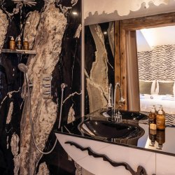 A Shower room in Chalet Cheval Blanc Meribel Le Raffort