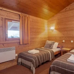 A Twin bedroom in Chalet Pierre Meribel Mottaret