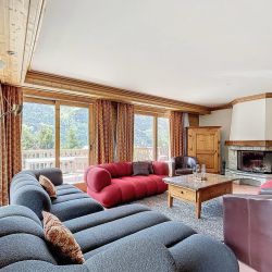 The Living area with fireplace in Chalet Serpolet Meribel Centre