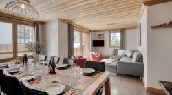 The Dining and Living area in Catered Chalet Sabot Val in Thorens The Dining and Living area in Catered Chalet Sabot Val in Thorens